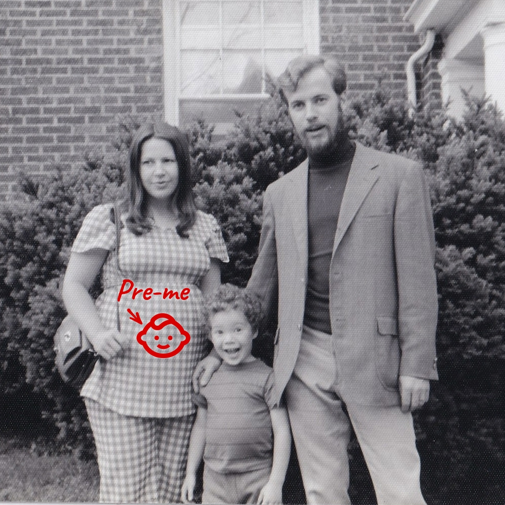 An old photo of my mom, dad, and brother.
